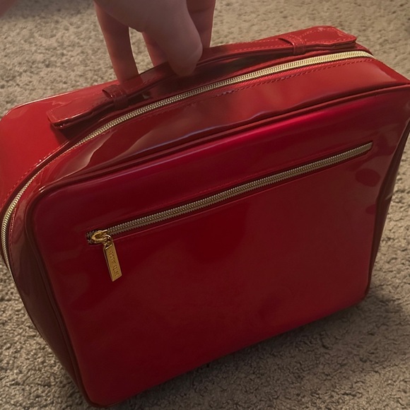 Estee Lauder Handbags - Glossy red Ester Lauder makeup bag